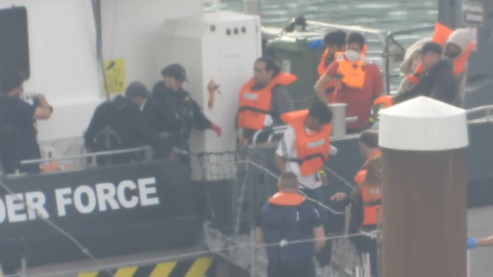 Migrants disembarking from border force boat in Dover