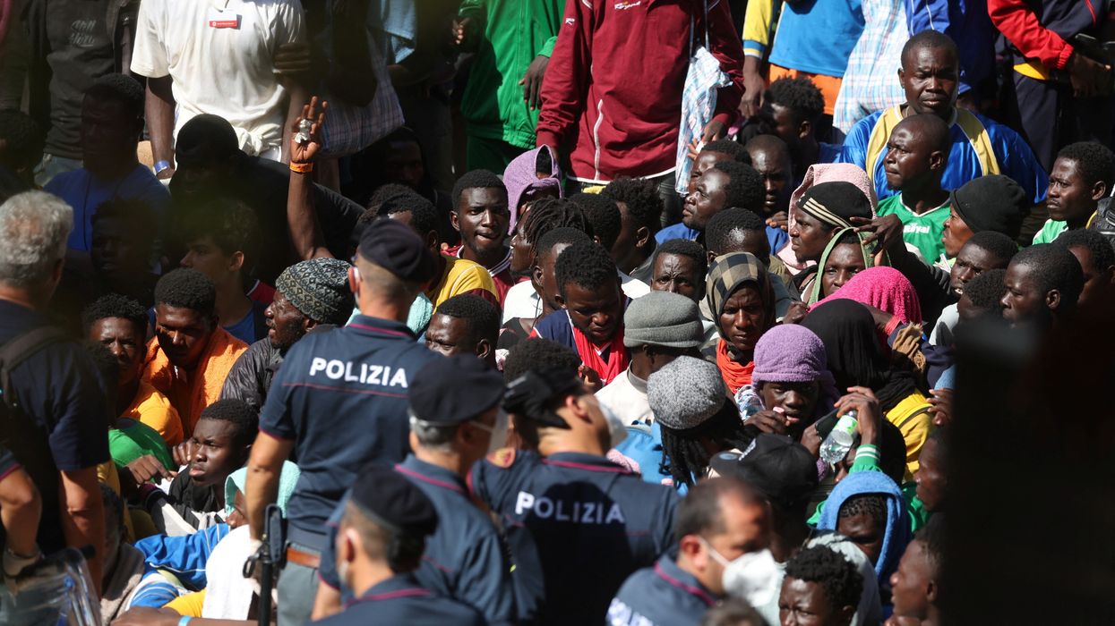 Migrants gather on the Italian island of Lampedusa