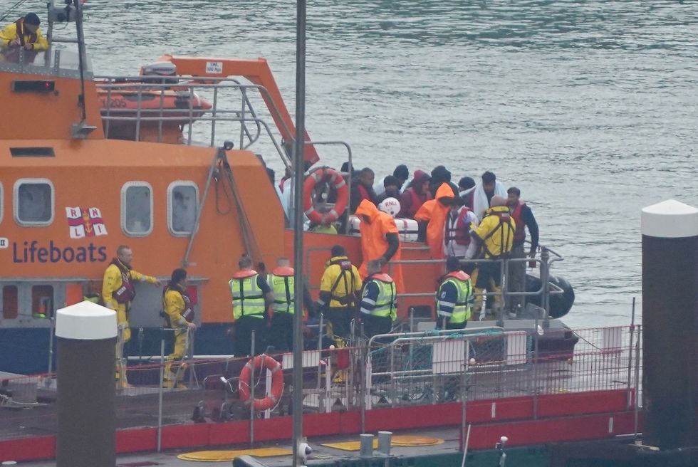 Migrants getting off a boat