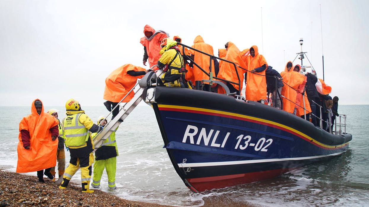Migrants getting off a lifeboat