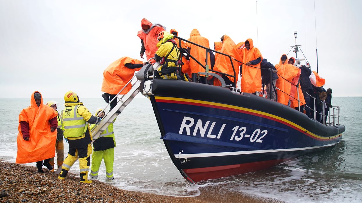 Migrants getting off a lifeboat