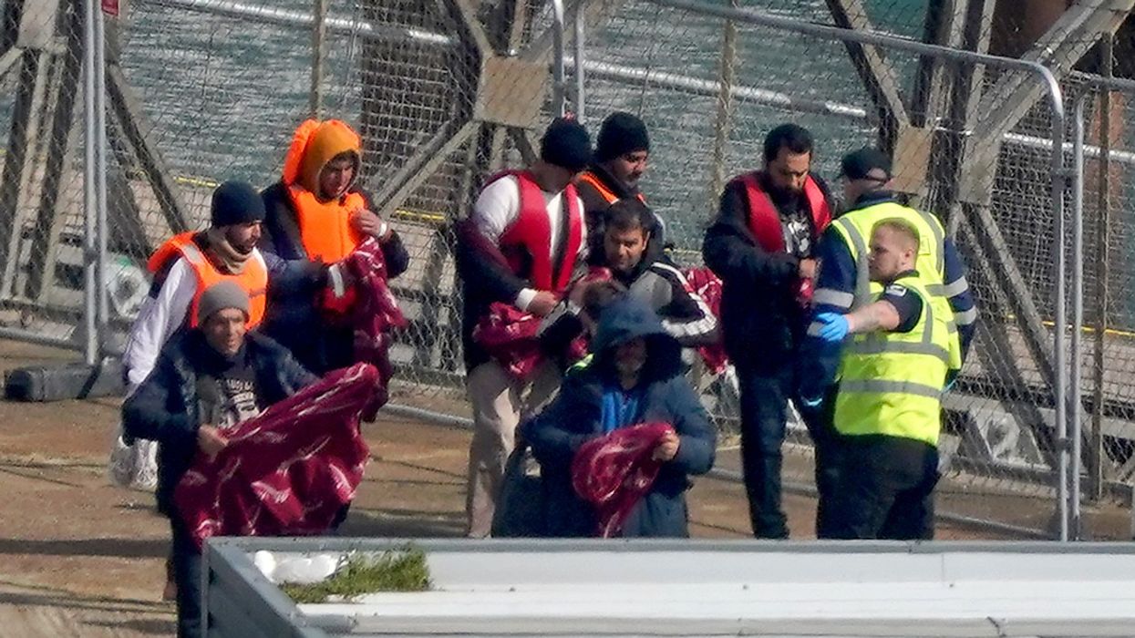 Migrants interacting with border patrol