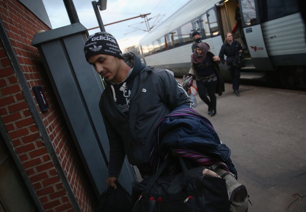 Migrants leave train for Sweden and Denmark