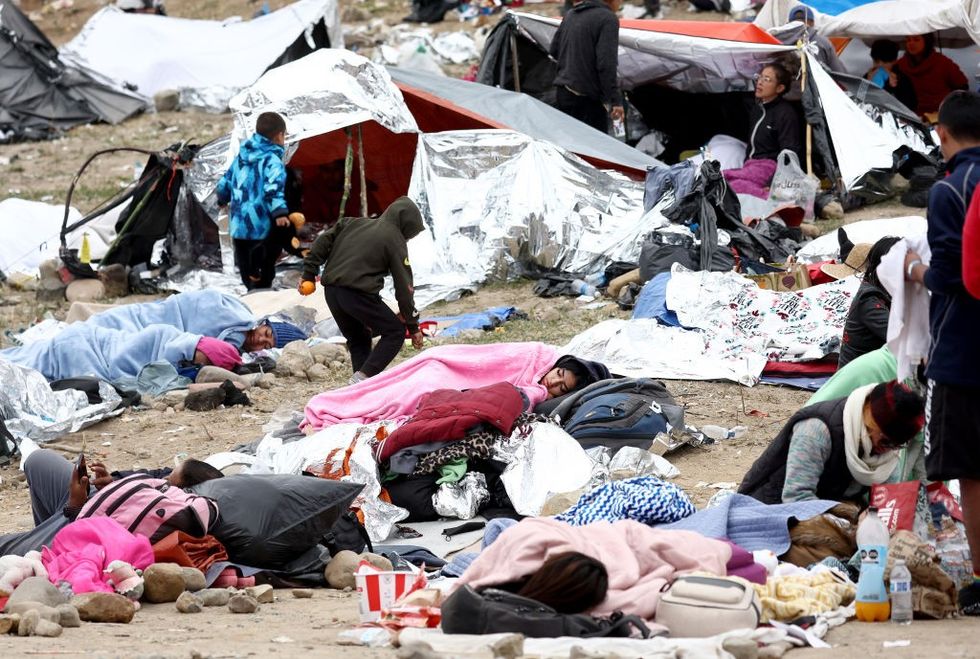 Migrants lying on the floor in California