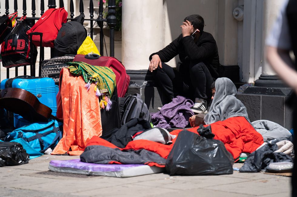 Migrants outside a hotel in Pimlico