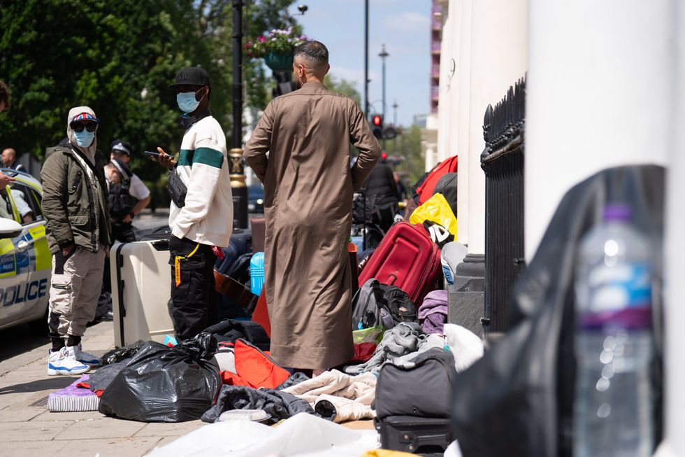 Migrants outside hotel