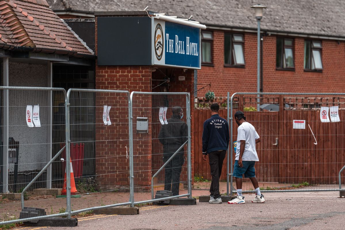 Migrants outside hotel
