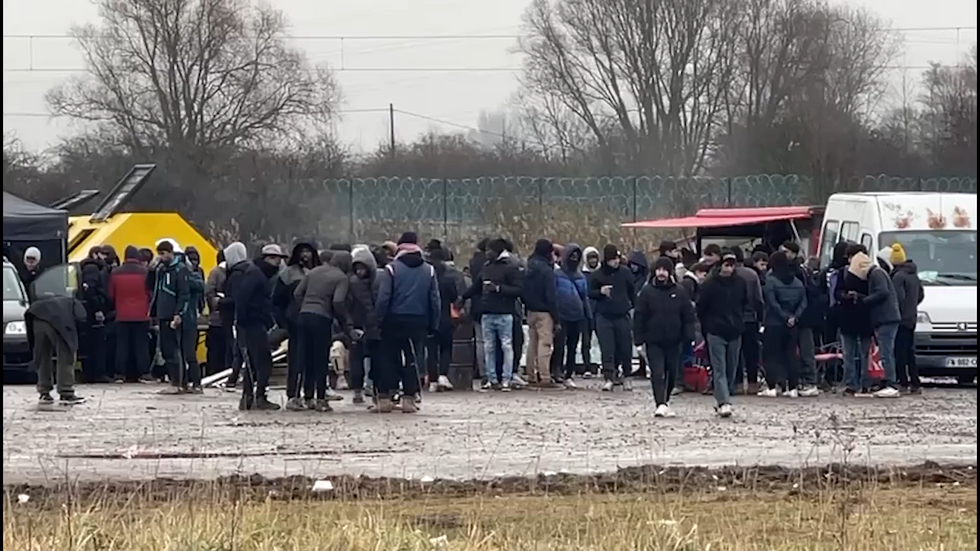 Migrants queueing in northern France