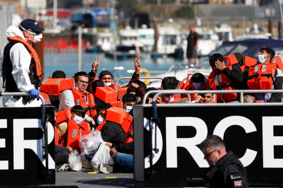 Migrants rescued from the English Channel are brought into Dover on the Border Force Catamaran Rescue Boat, BF Hurricane
