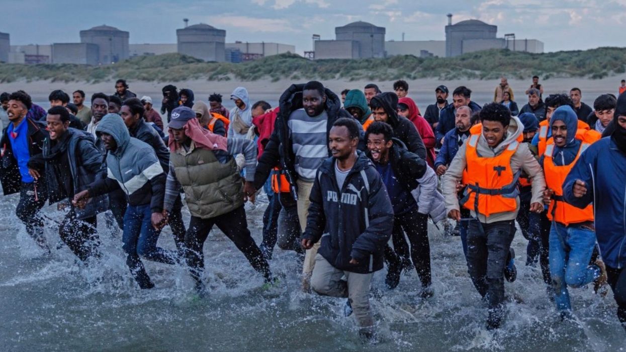 Migrants running to the sea