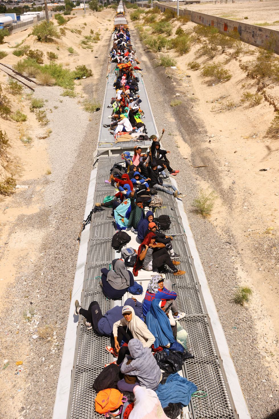 Migrants travel on a train with the intention of reaching the United States, in Ciudad Juarez, Mexico