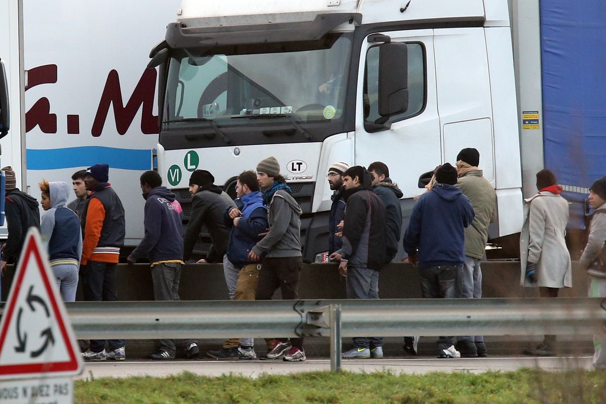 Migrants trying to enter lorries in Calais