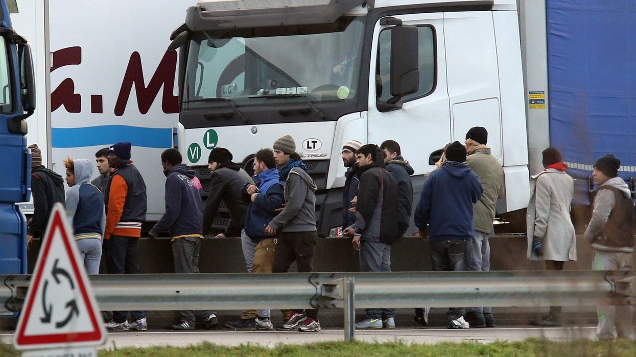 Migrants trying to enter lorries in Calais