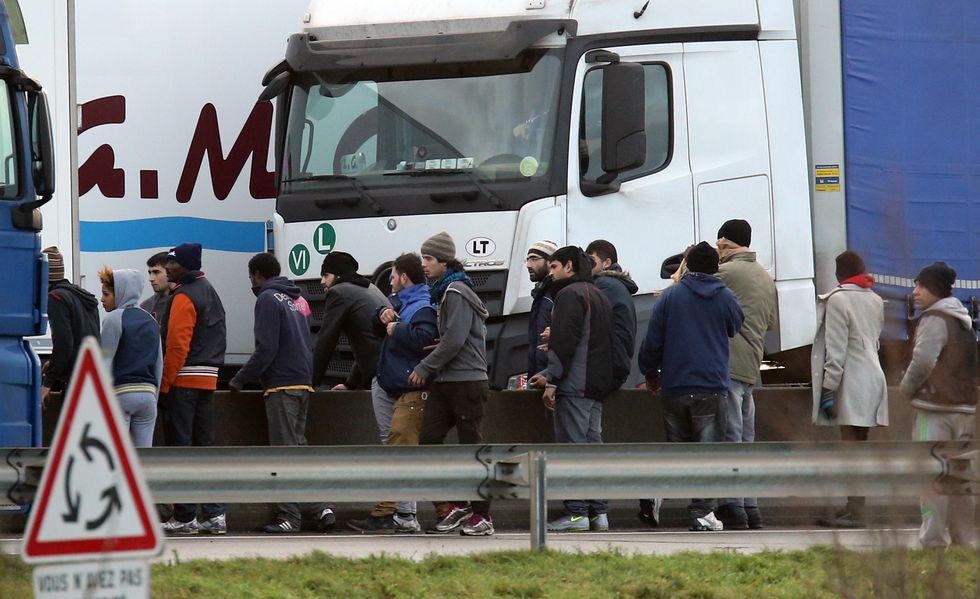 Migrants trying to enter lorries in Calais