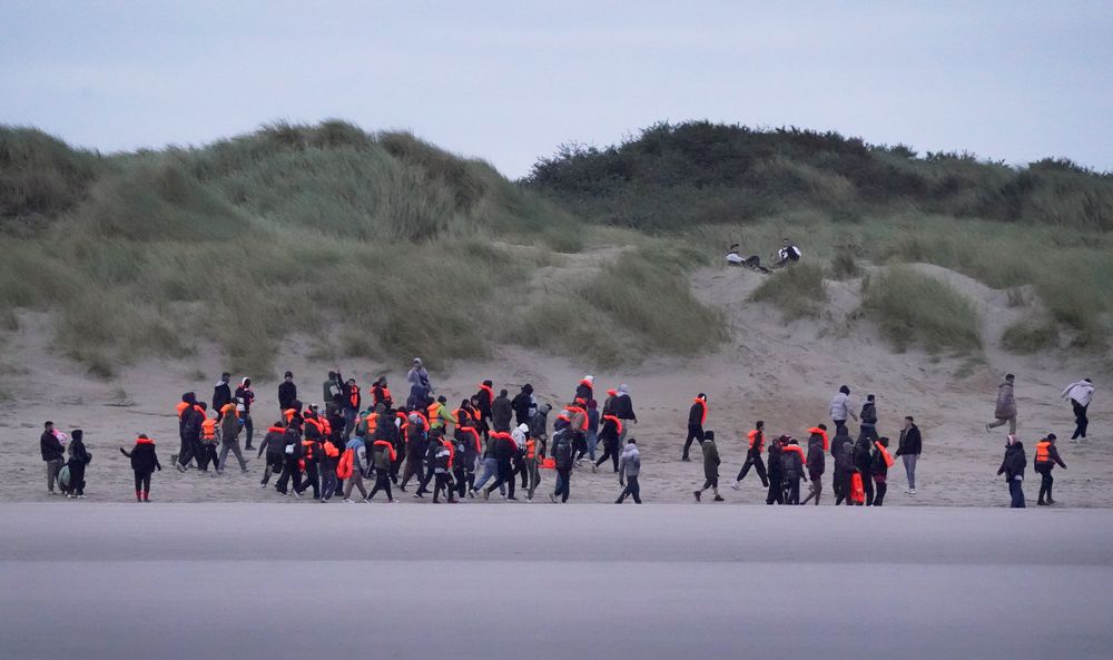 Migrants waiting on the beach in norhtern France