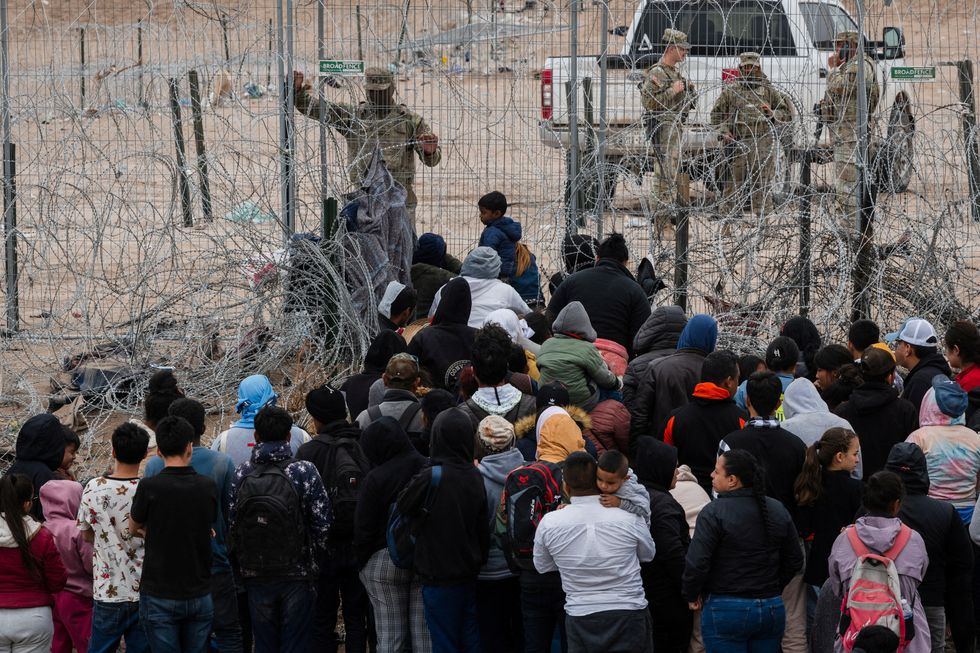 Migrants walking through
