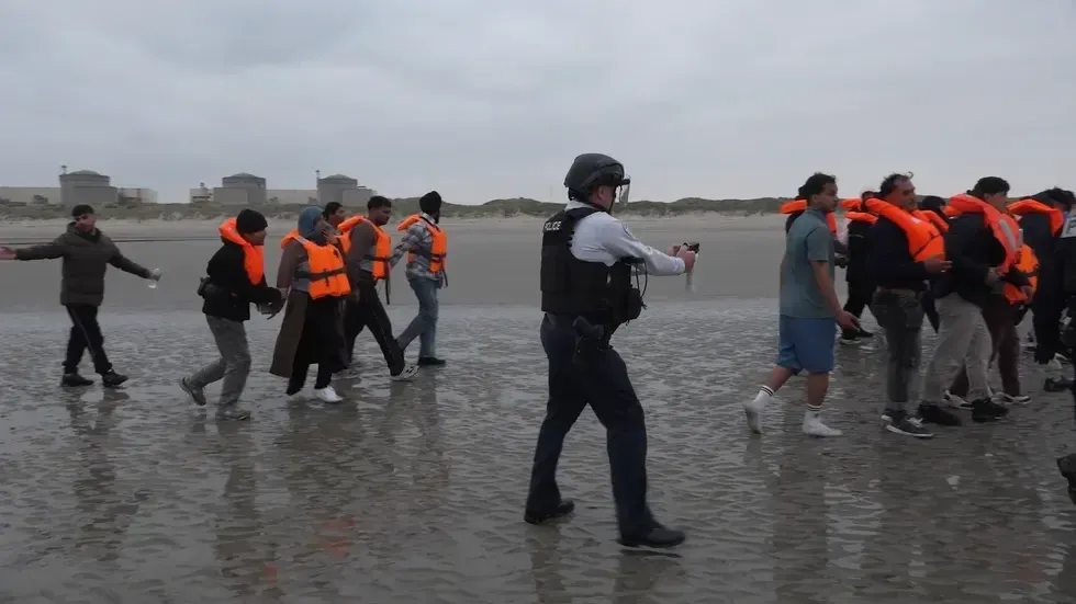 Migrants were stopped from reaching a small boat by French police