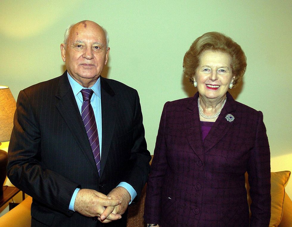 Mikhail Gorbachev stands with Margaret Tharcher during a meeting in London