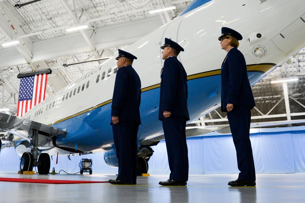 Military personnel stand by Air Force One at Joint Base Andrews in Maryland