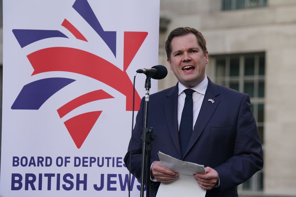 Minister of State for Immigration Robert Jenrick speaking during a vigil outside Downing Street, central London