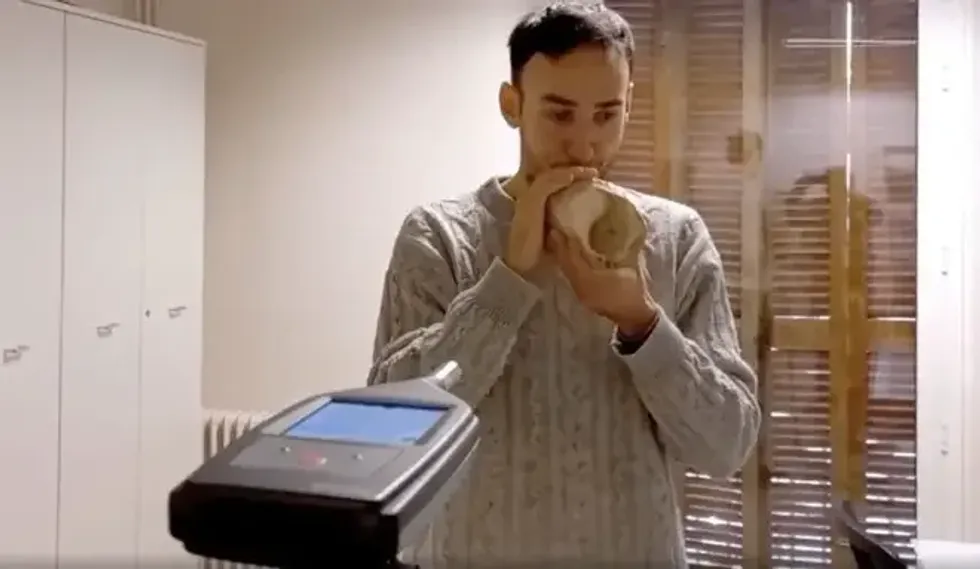 Miquel Lopez-Garcia plays the conch