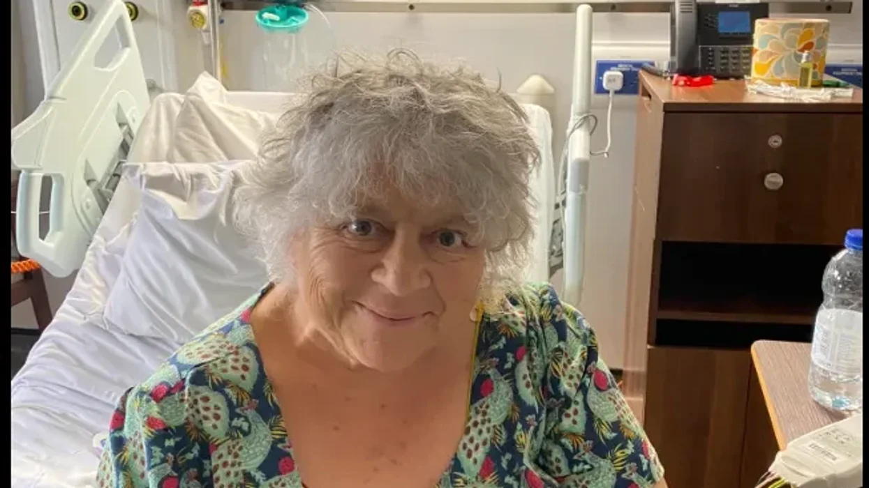 Miriam Margolyes smiles from her hospital bed