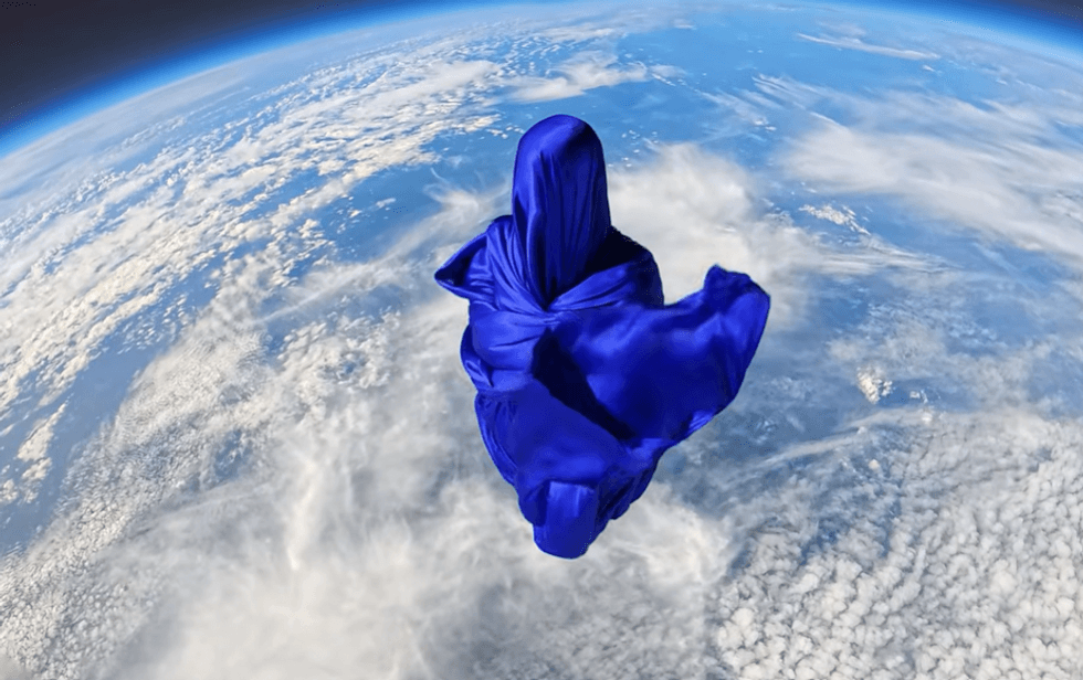 Mission Taroni by The Dorothy Project - a ghostly figuring above Earth