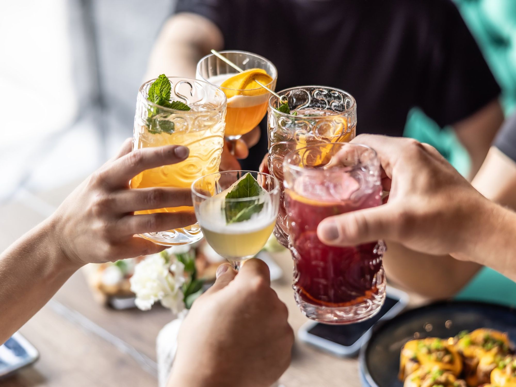 Mixed drinks held up in center