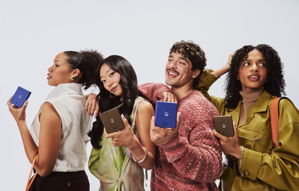 Models posing with the Motorola razr 70 and 70 Ultra