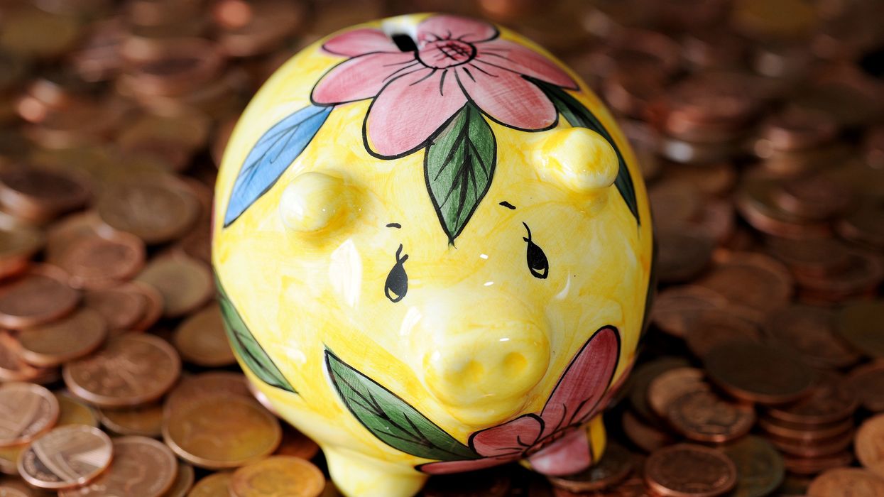 Money box on 2p and 1p coins