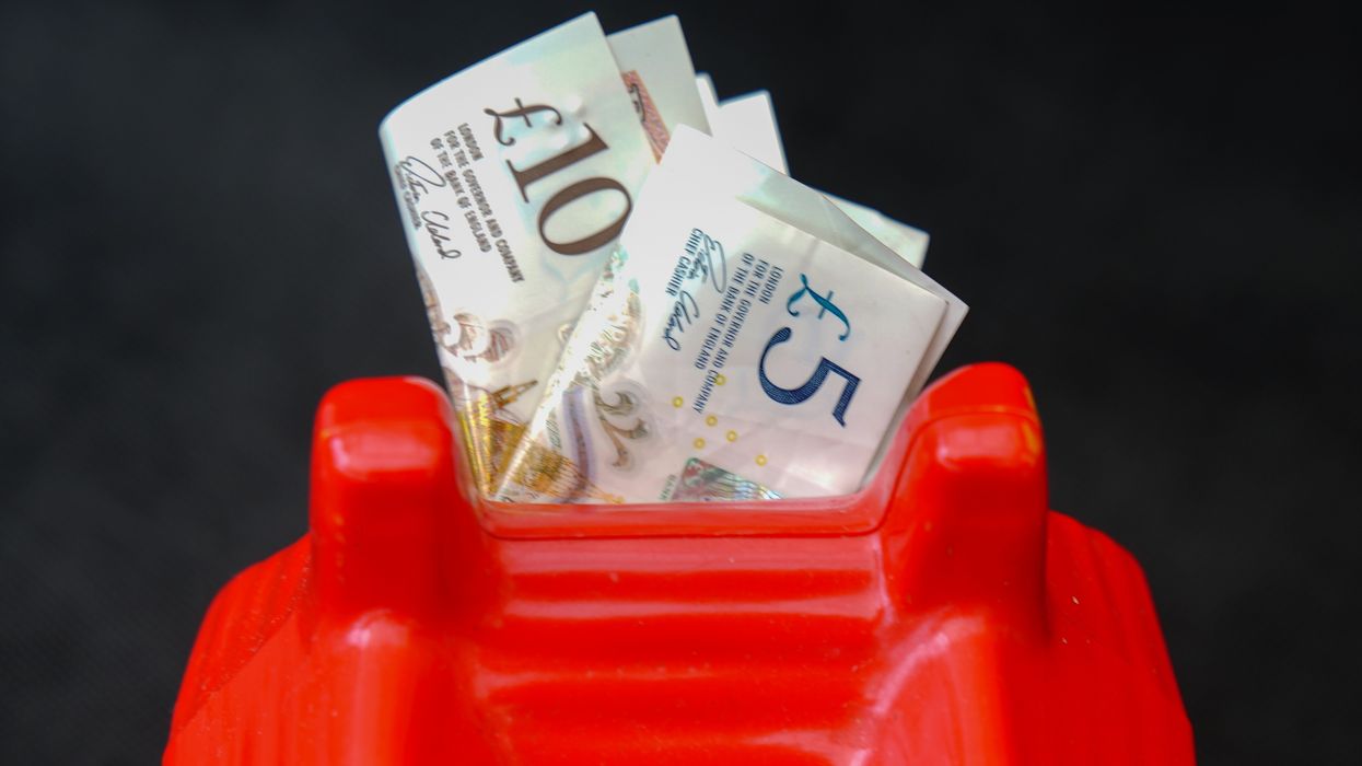 Money stashed into a toy house