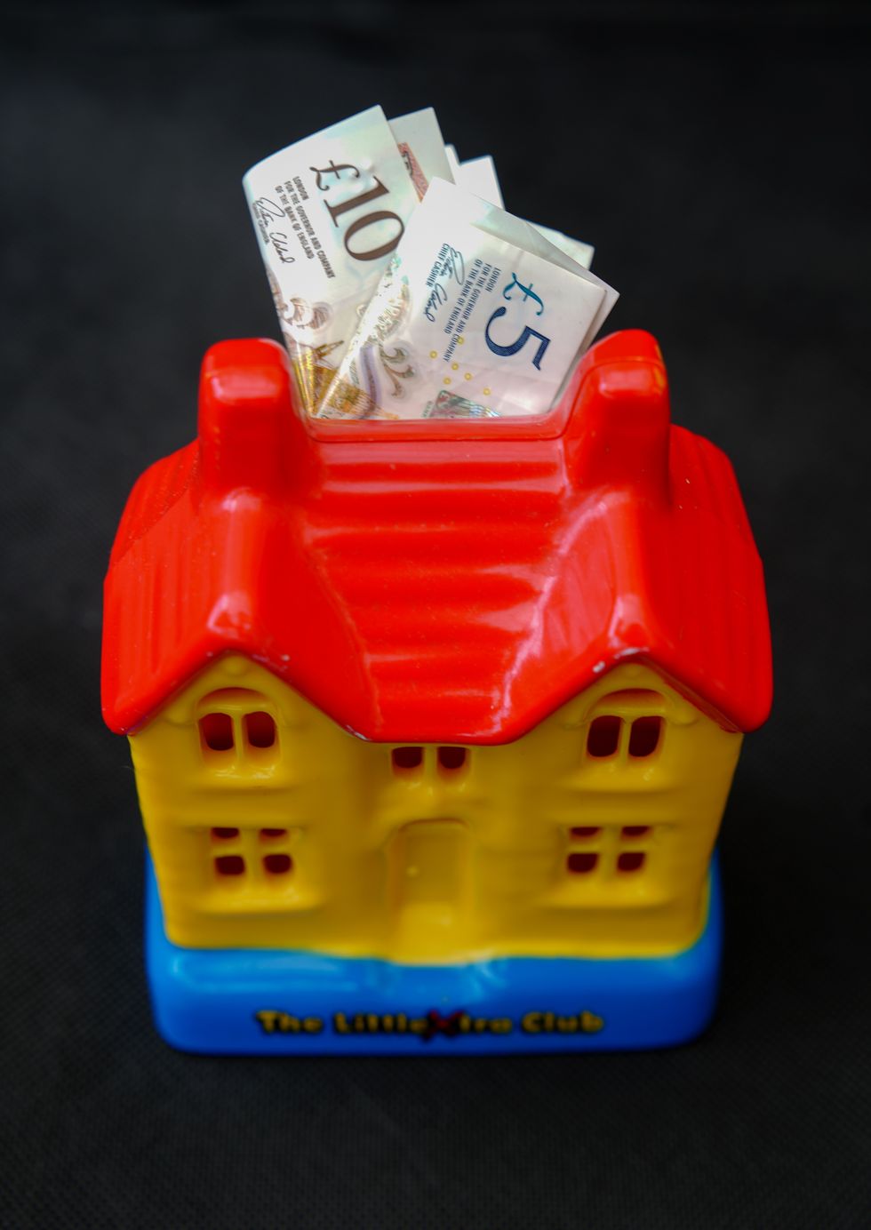 Money stashed into a toy house