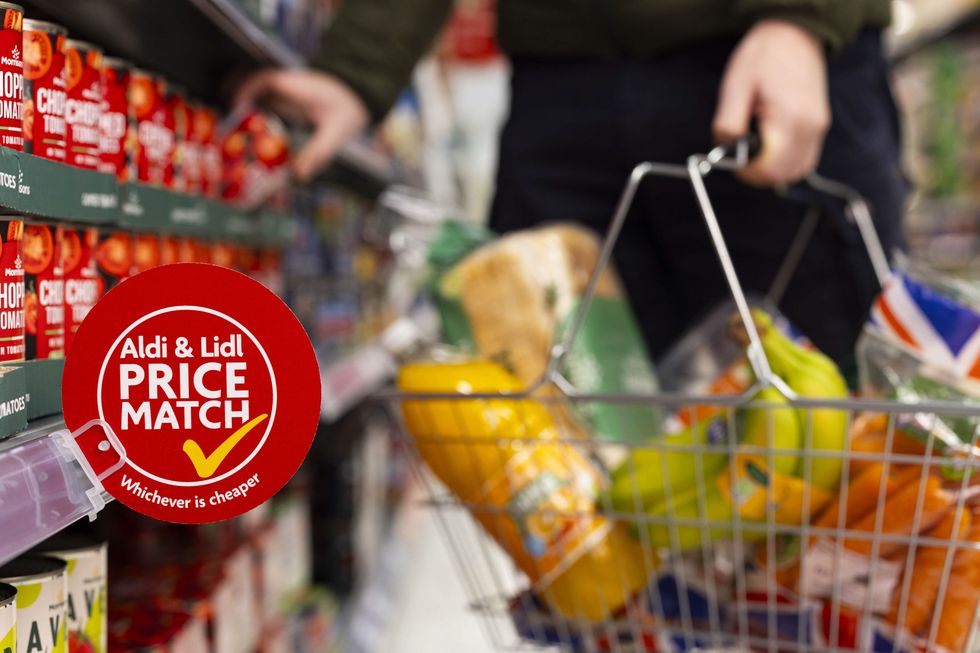 Morrisons products and new Aldi and Lidl price match guarantee sign on shelves