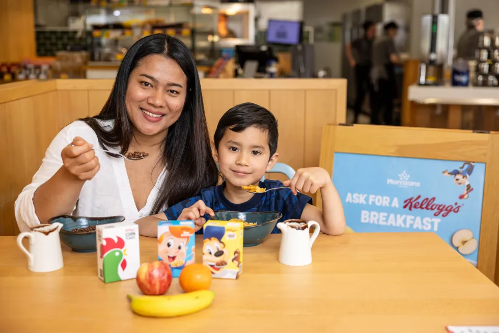 Mother and child eating Kellogg's in Morrisons caf\u00e9