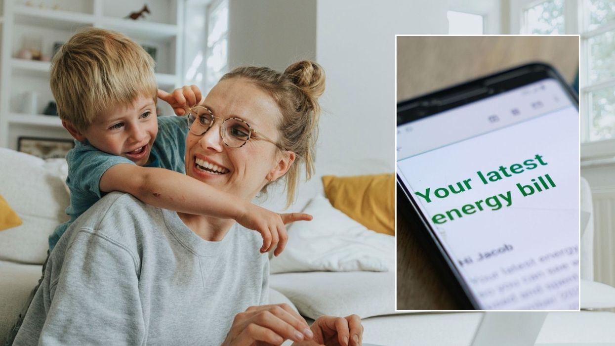 Mother and child, energy bill on phone