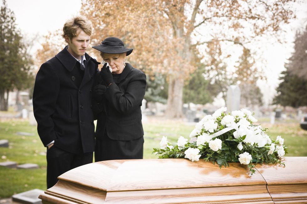 Mother and son at funeral