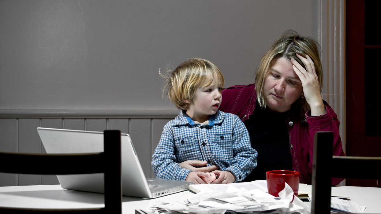 Mother and son at laptop distressed
