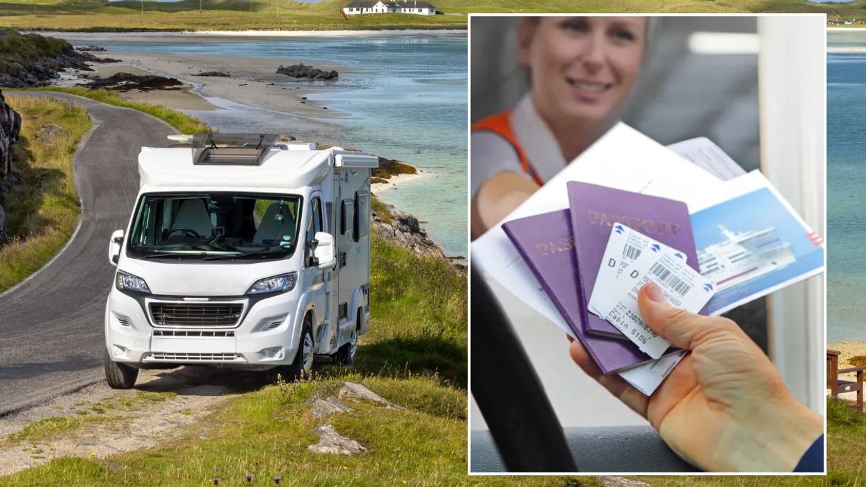 Motorhome and a man handing documents over to a border control officer