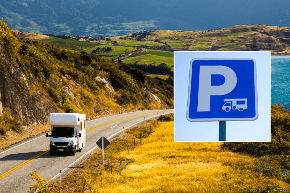 Motorhome on road and parking sign