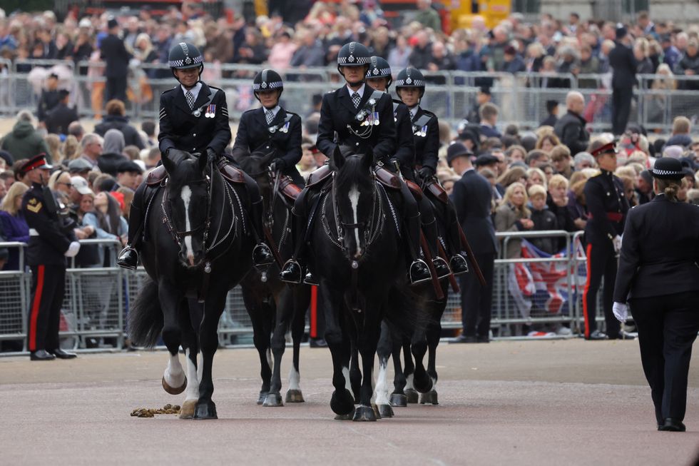 Mounted police officers during the procession for the State Funeral of Queen Elizabeth II, held at Westminster Abbey, London.