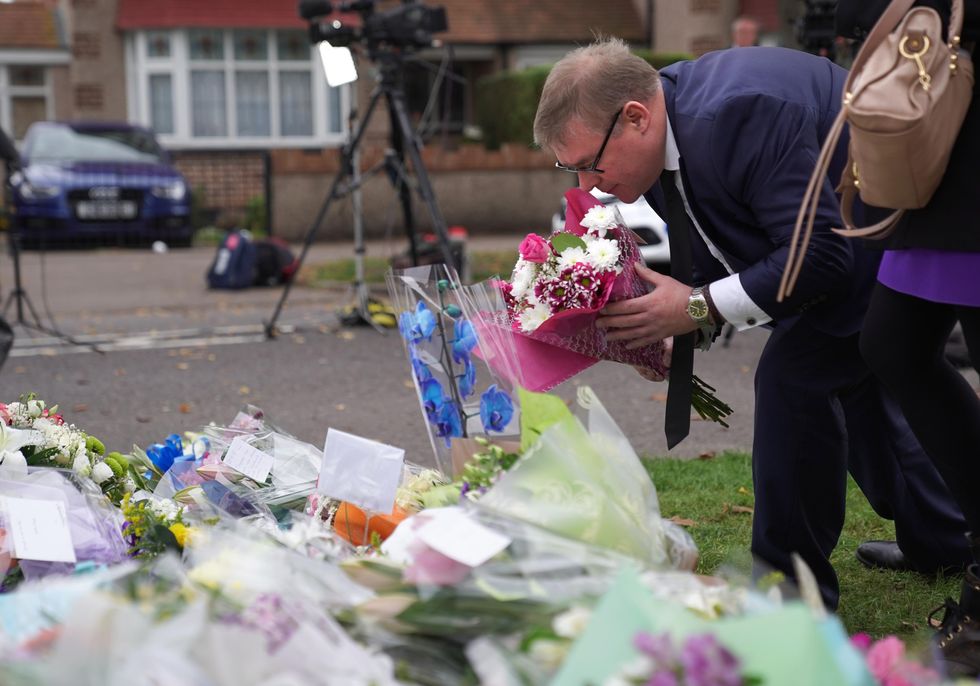 MP Mark Francois lays flowers at the scene near Belfairs Methodist Church in Eastwood Road North, Leigh-on-Sea, Essex, where Conservative MP Sir David Amess died after he was stabbed several times at a constituency surgery on Friday.