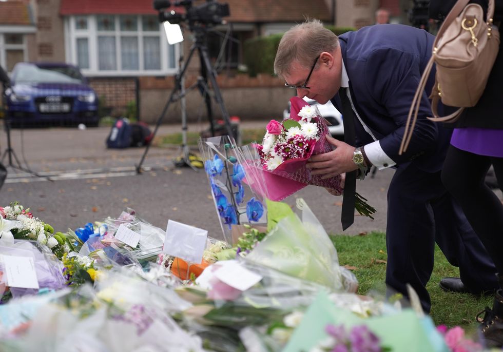 MP Mark Francois lays flowers at the scene near Belfairs Methodist Church in Eastwood Road North, Leigh-on-Sea.