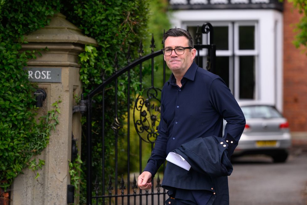 Mr Burnham pictured today leaving his home in Warrington as he heads to the FA Cup Final in Wembley