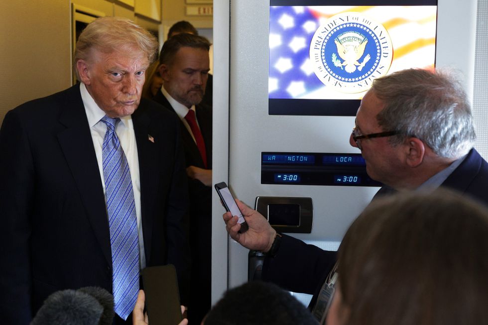 Mr Trump speaking from Air Force One on Friday after returning from Beijing