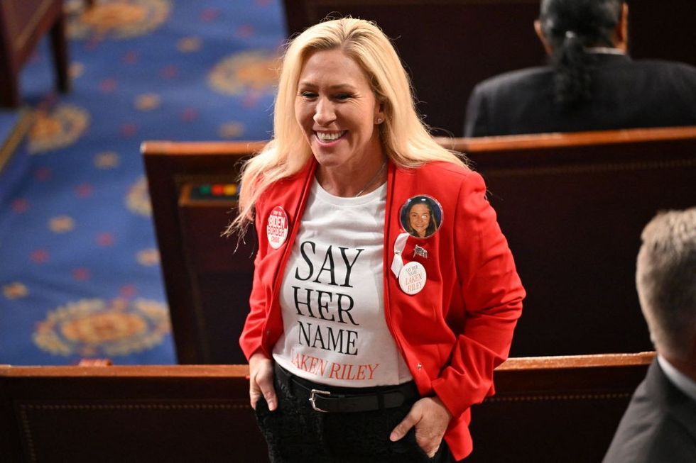MTG wearing a "say her name" shirt
