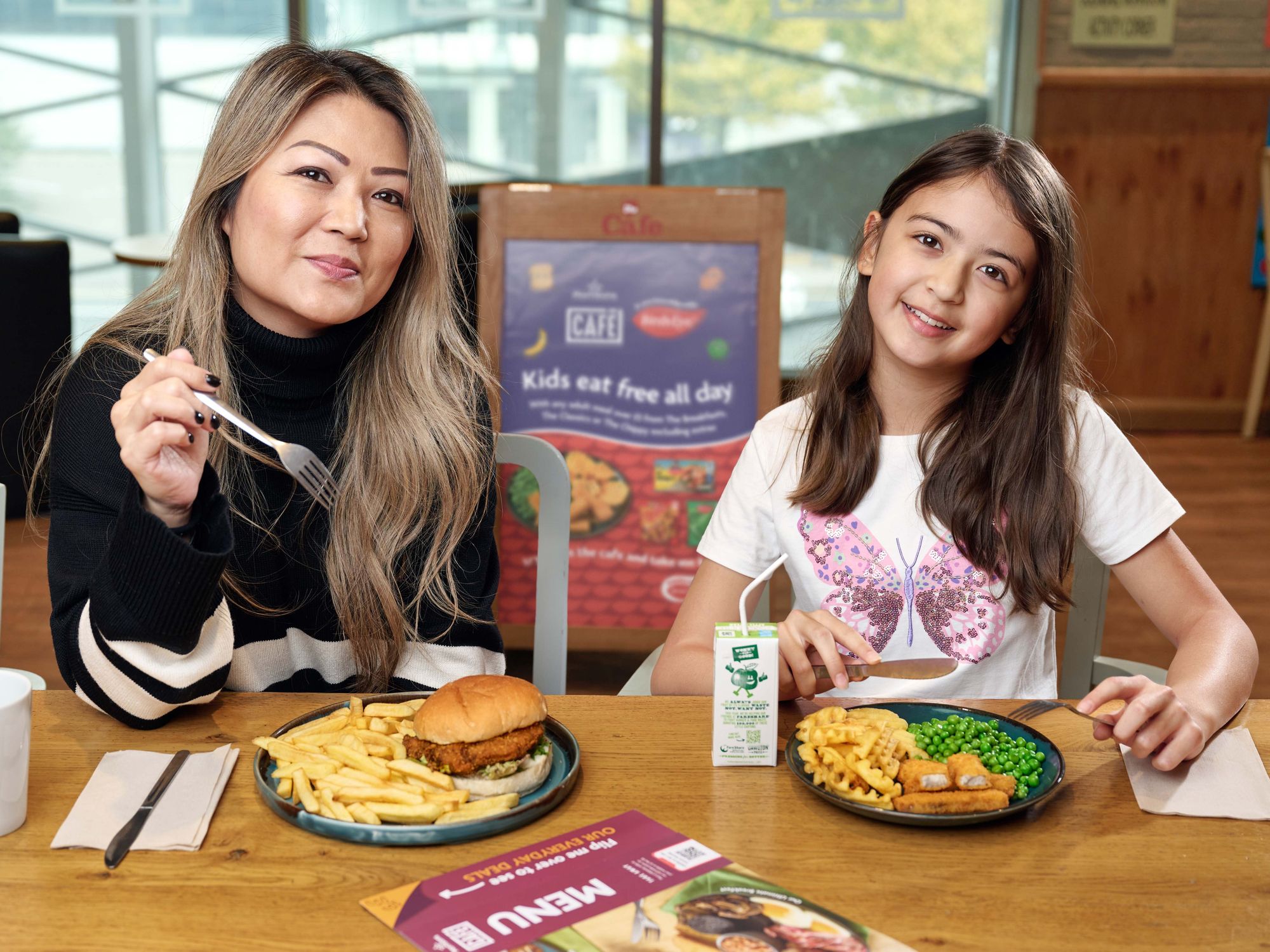 Mum and daughter eating at Morrisons