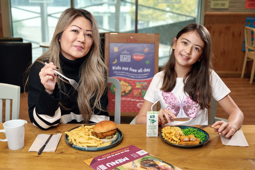 Mum and daughter eating at Morrisons