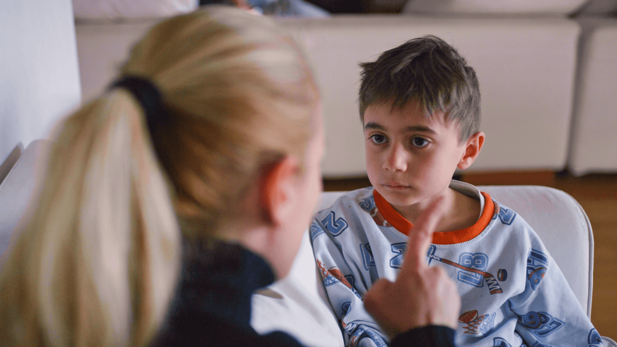 Mum telling off her child