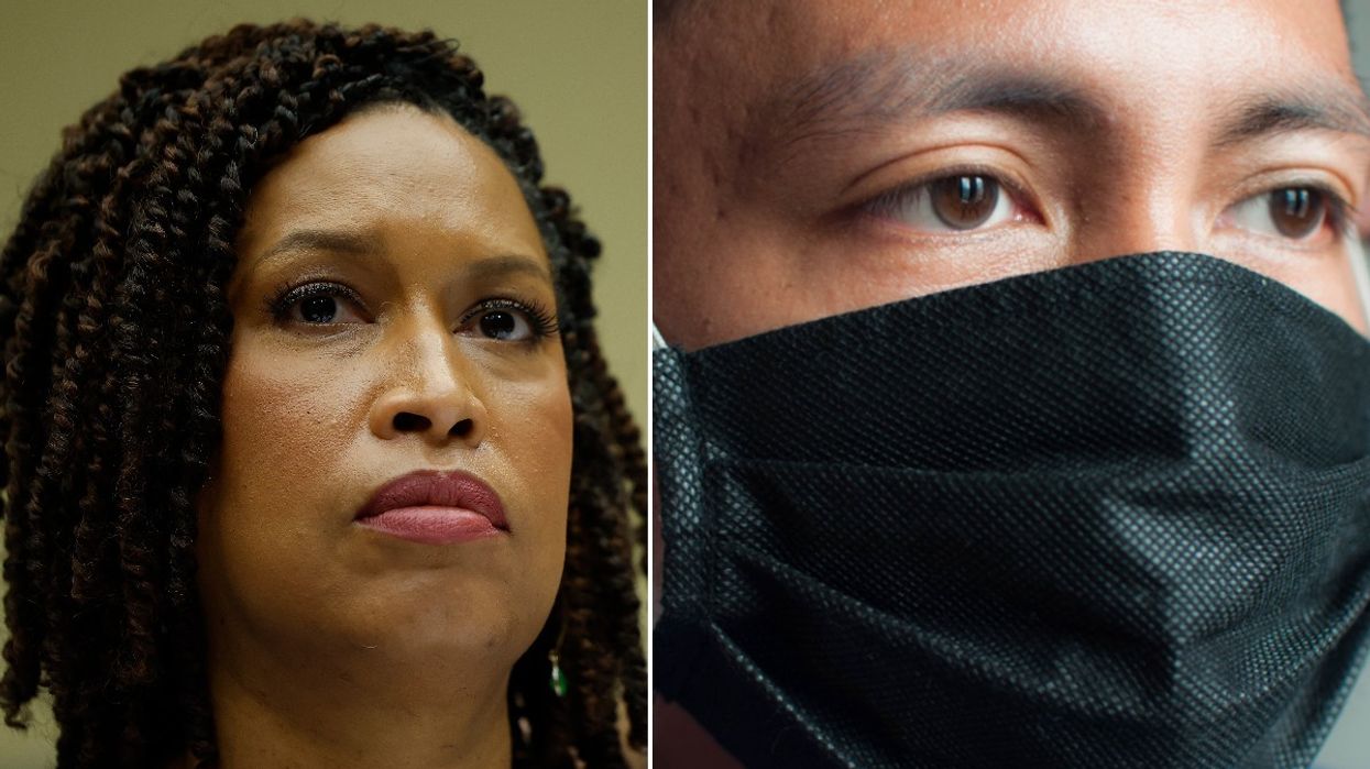 Muriel Bowser and man wearing black facemask