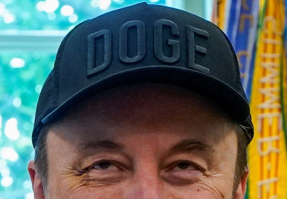 Musk wearing his Doge cap